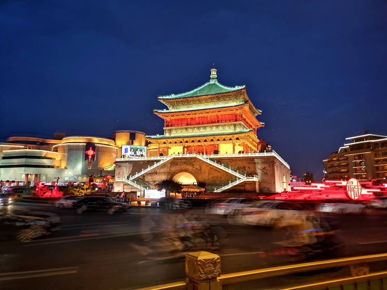 Xi'an Bell Tower illuminated above the surrounding roads